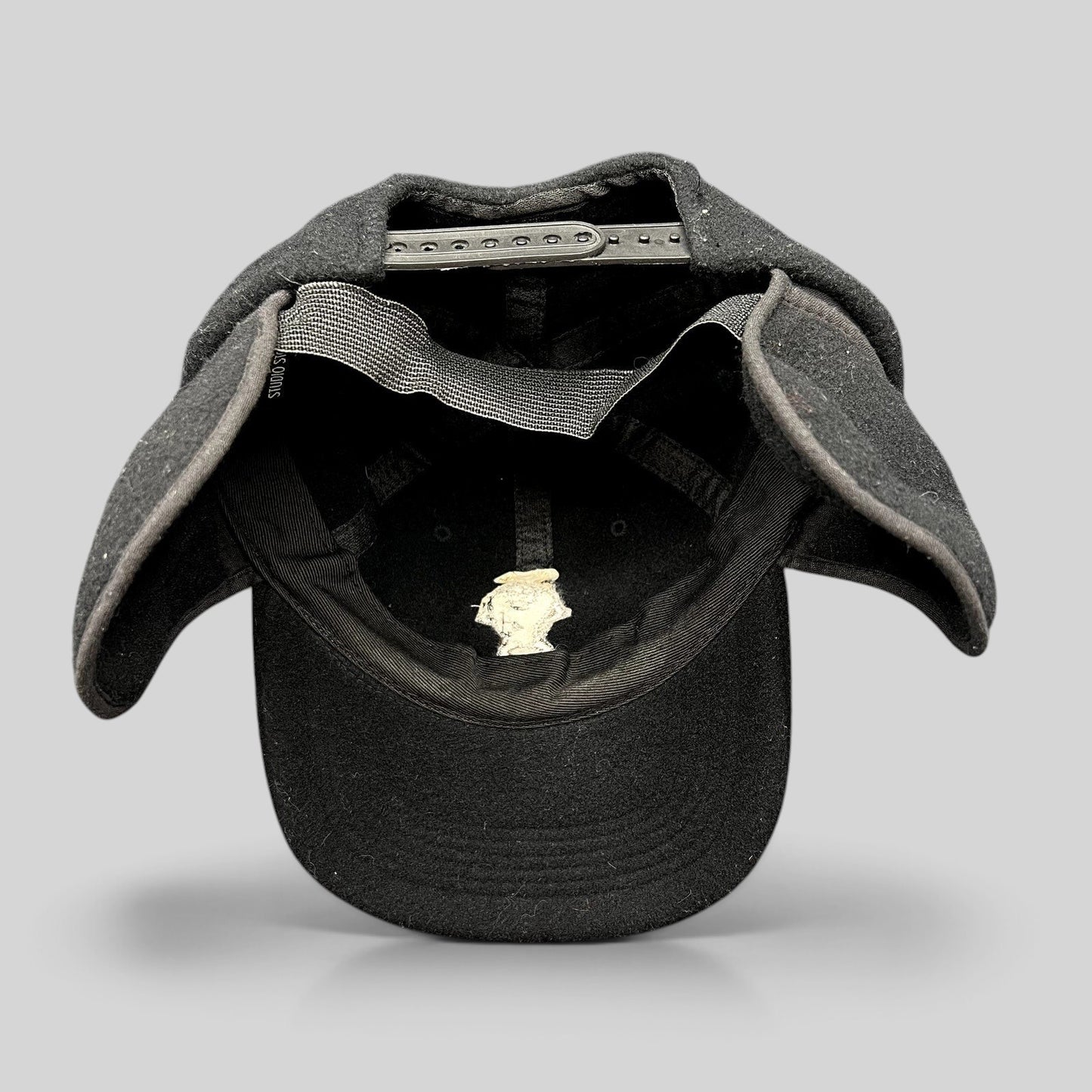 Raree Finds vintage 1995 Warner Bros black wool snapback hat with fold-down ear flaps and embroidered Taz character