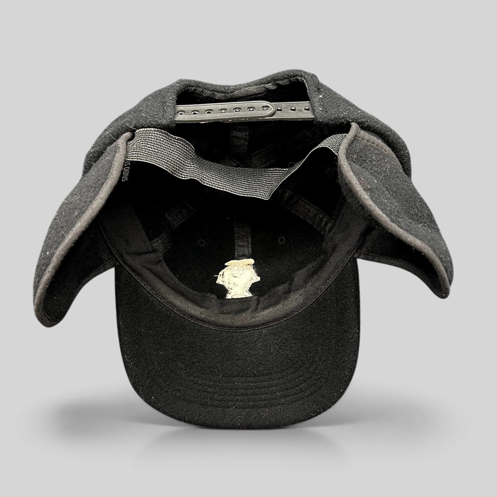 Raree Finds vintage 1995 Warner Bros black wool snapback hat with fold-down ear flaps and embroidered Taz character