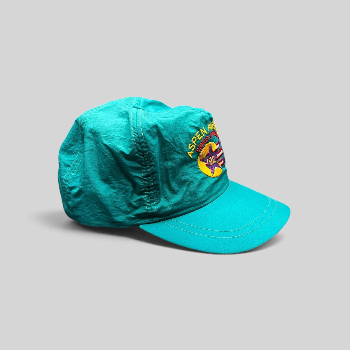 Raree Finds vintage 1992 Aspen Air Show teal nylon snapback hat with Wings of Freedom embroidered graphic