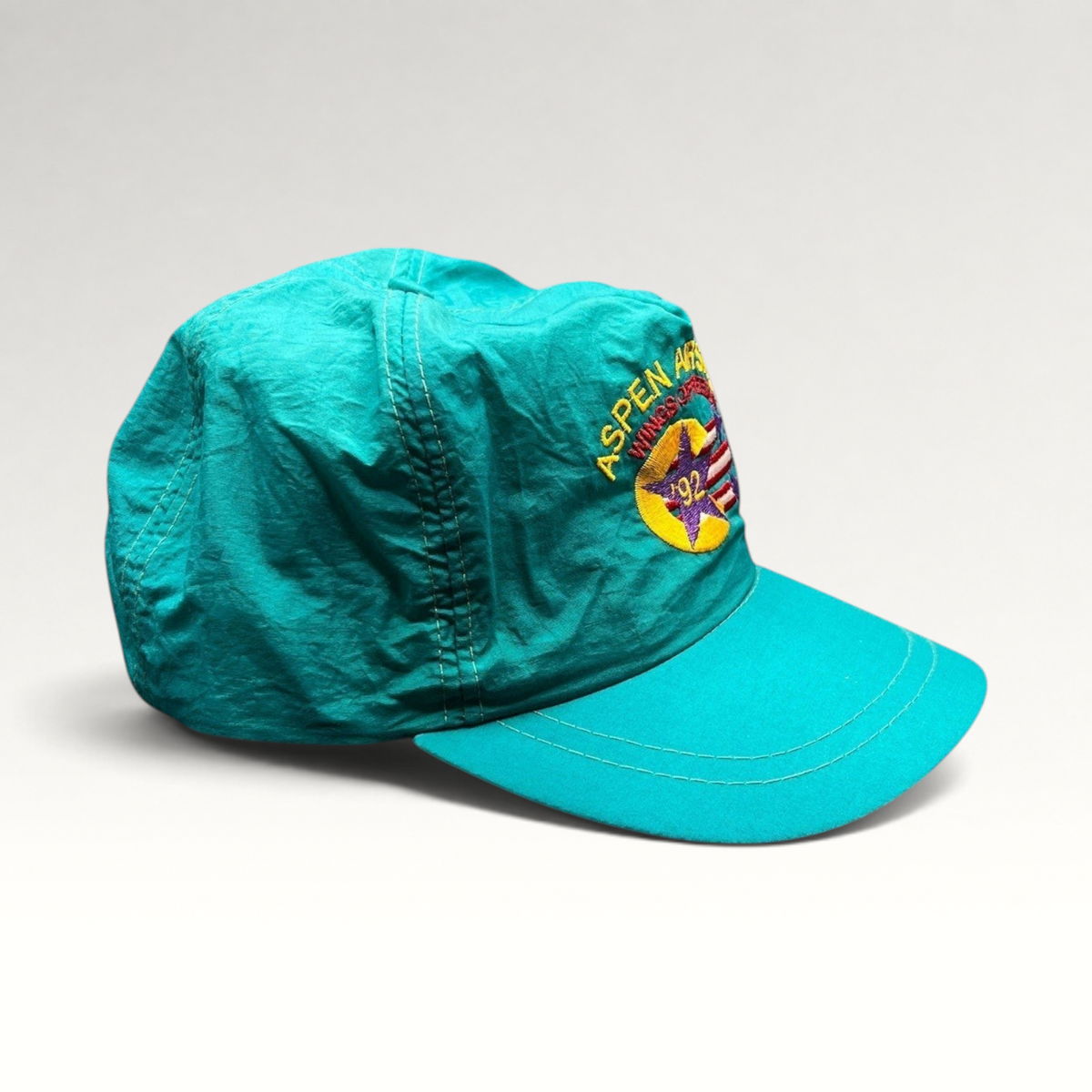 Raree Finds vintage 1992 Aspen Air Show teal nylon snapback hat with Wings of Freedom embroidered graphic