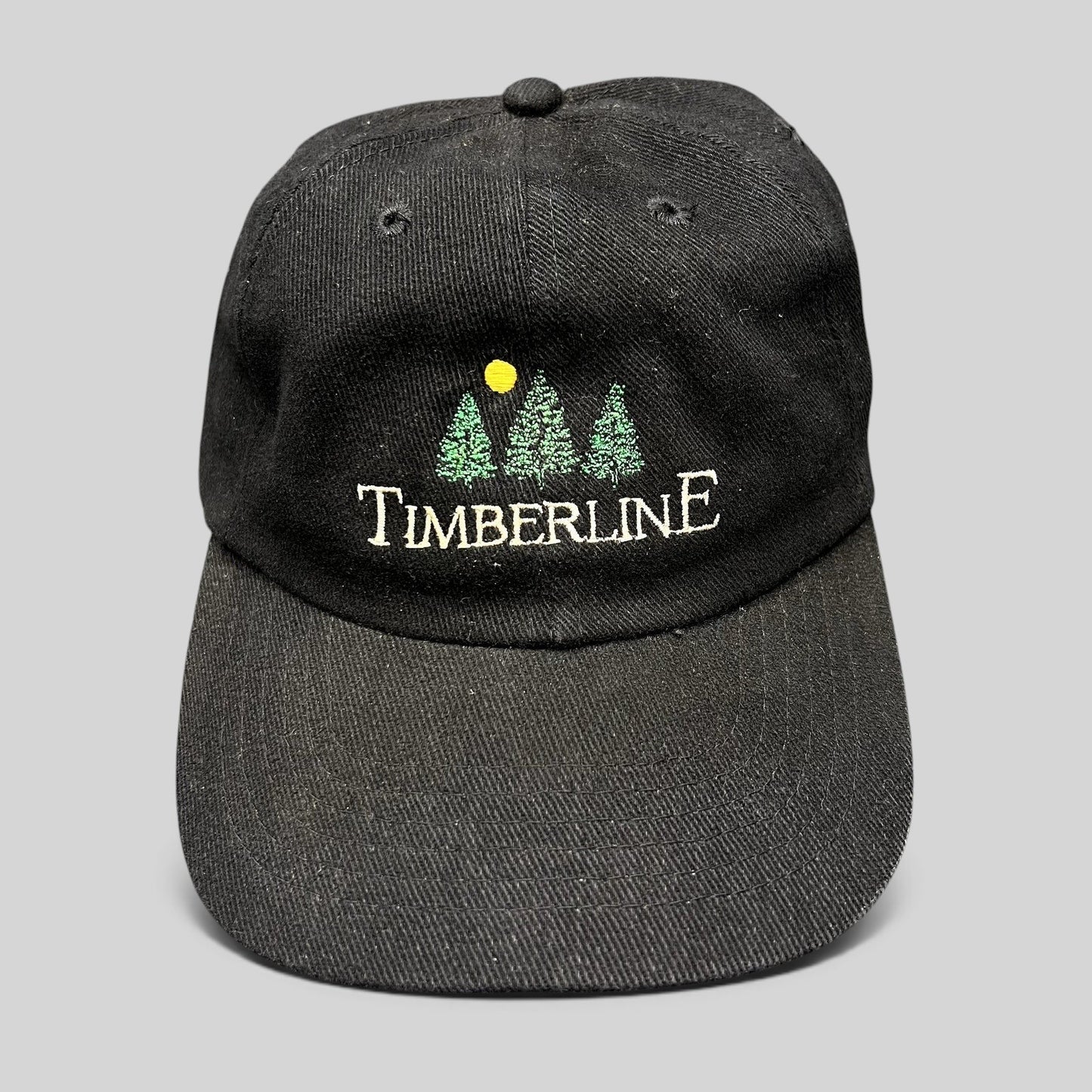 Raree Finds vintage 1990s black Timberline strapback hat with embroidered green pine trees and yellow sun logo