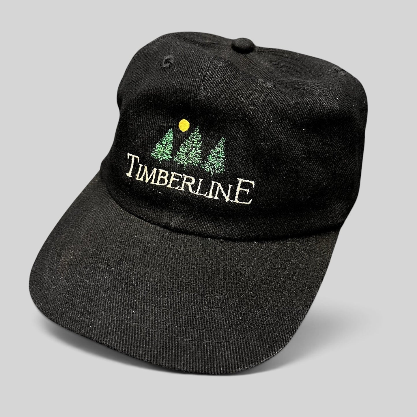 Raree Finds vintage 1990s black Timberline strapback dad hat with embroidered tree logo and restaurant branding