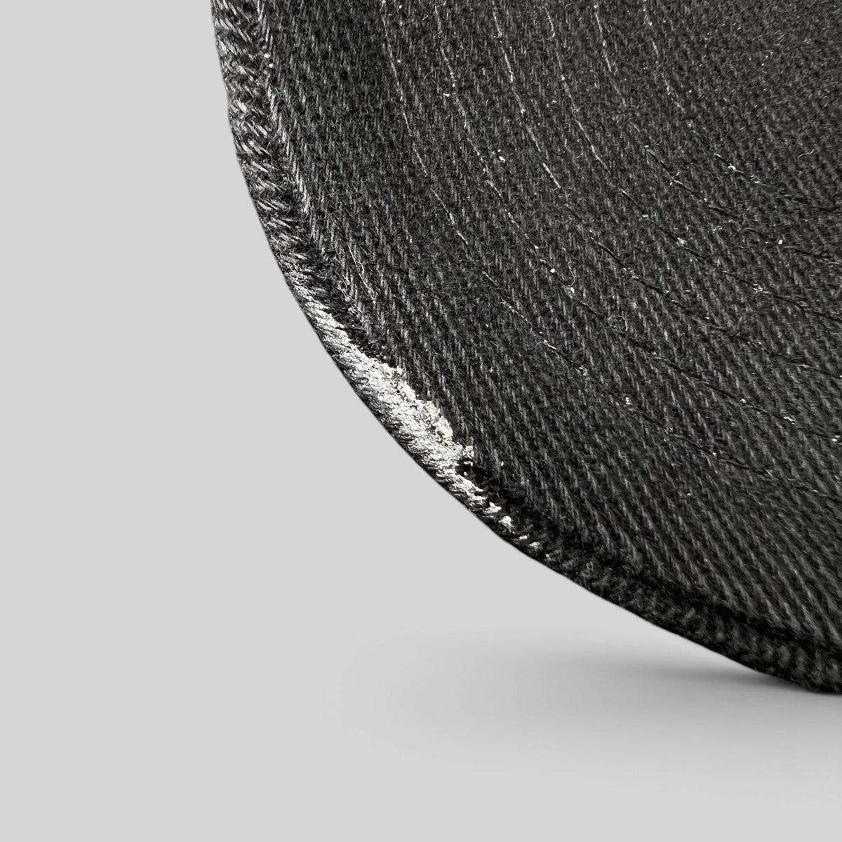 Raree Finds vintage 1990s black Timberline strapback hat brim detail showing worn texture