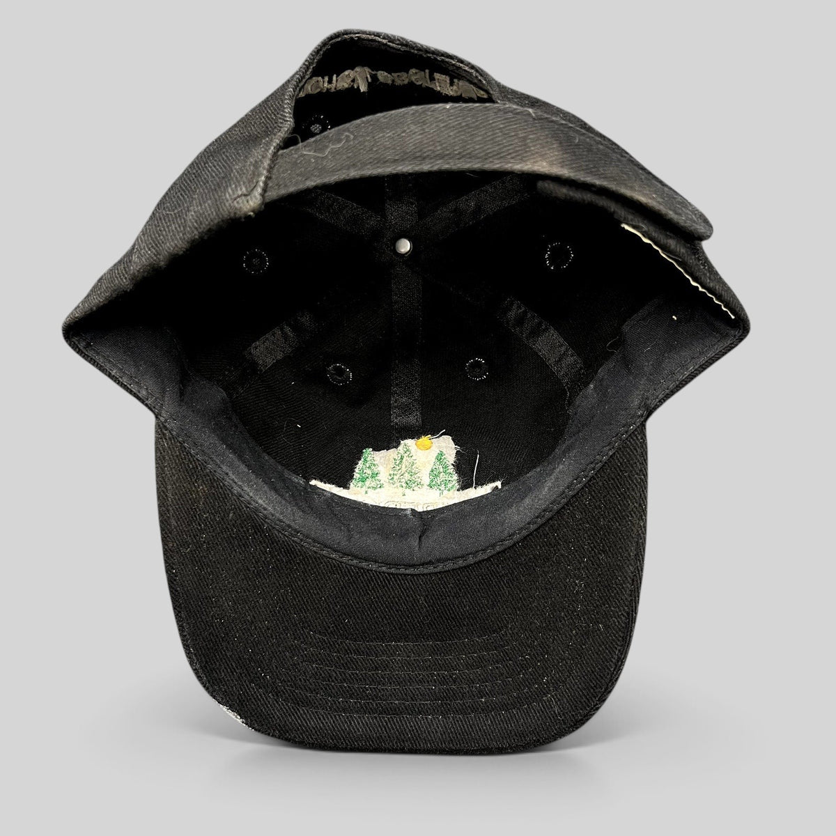 Raree Finds vintage 1990s black Timberline strapback hat showing the interior construction and embroidered logo
