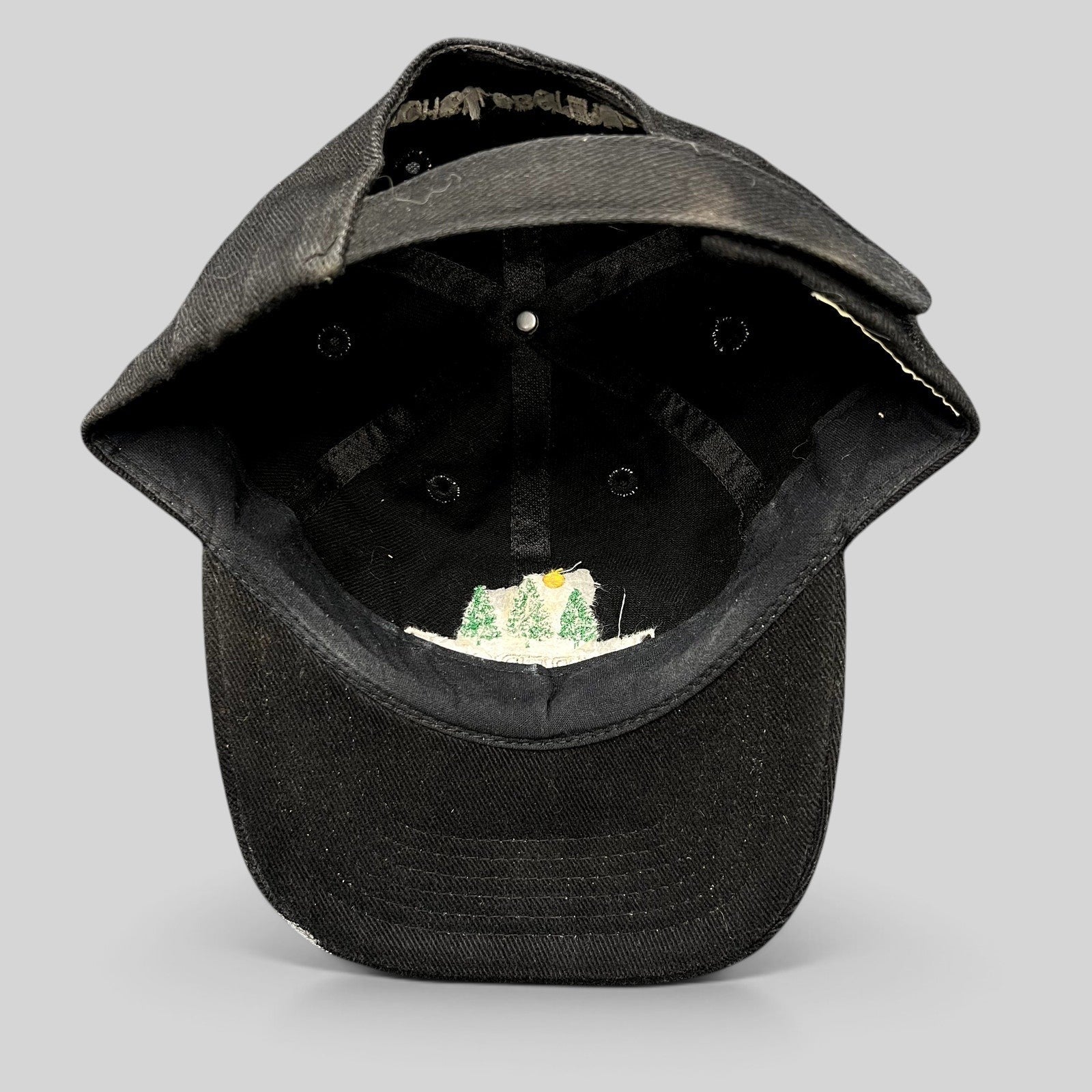 Raree Finds vintage 1990s black Timberline strapback hat showing the interior construction and embroidered logo