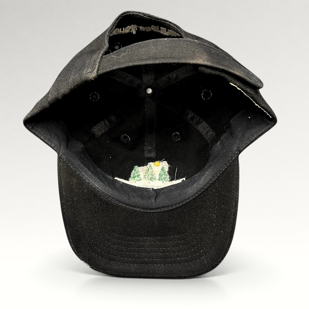 Raree Finds vintage 1990s black Timberline strapback hat showing the interior construction and embroidered logo