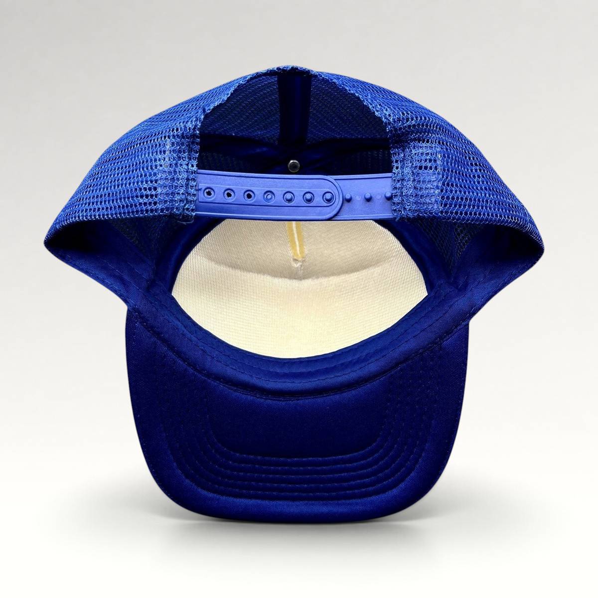 Raree Finds vintage Marlin Masters trucker hat showing the blue mesh back and adjustable plastic snapback closure.