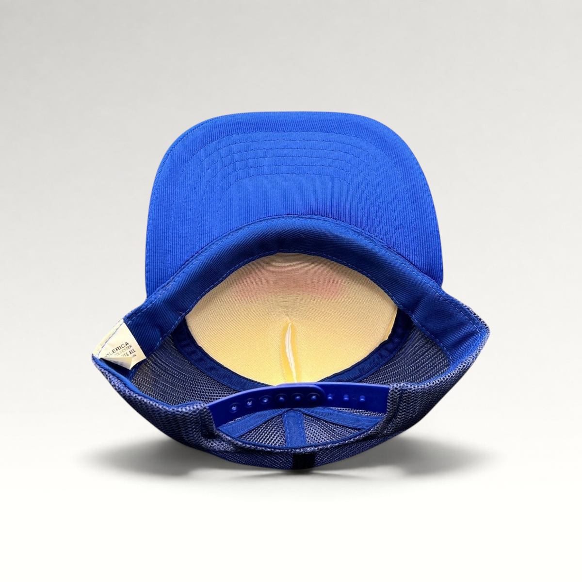 Raree Finds vintage Miller Famous Ice Cream trucker hat showing the royal blue mesh back and adjustable snapback