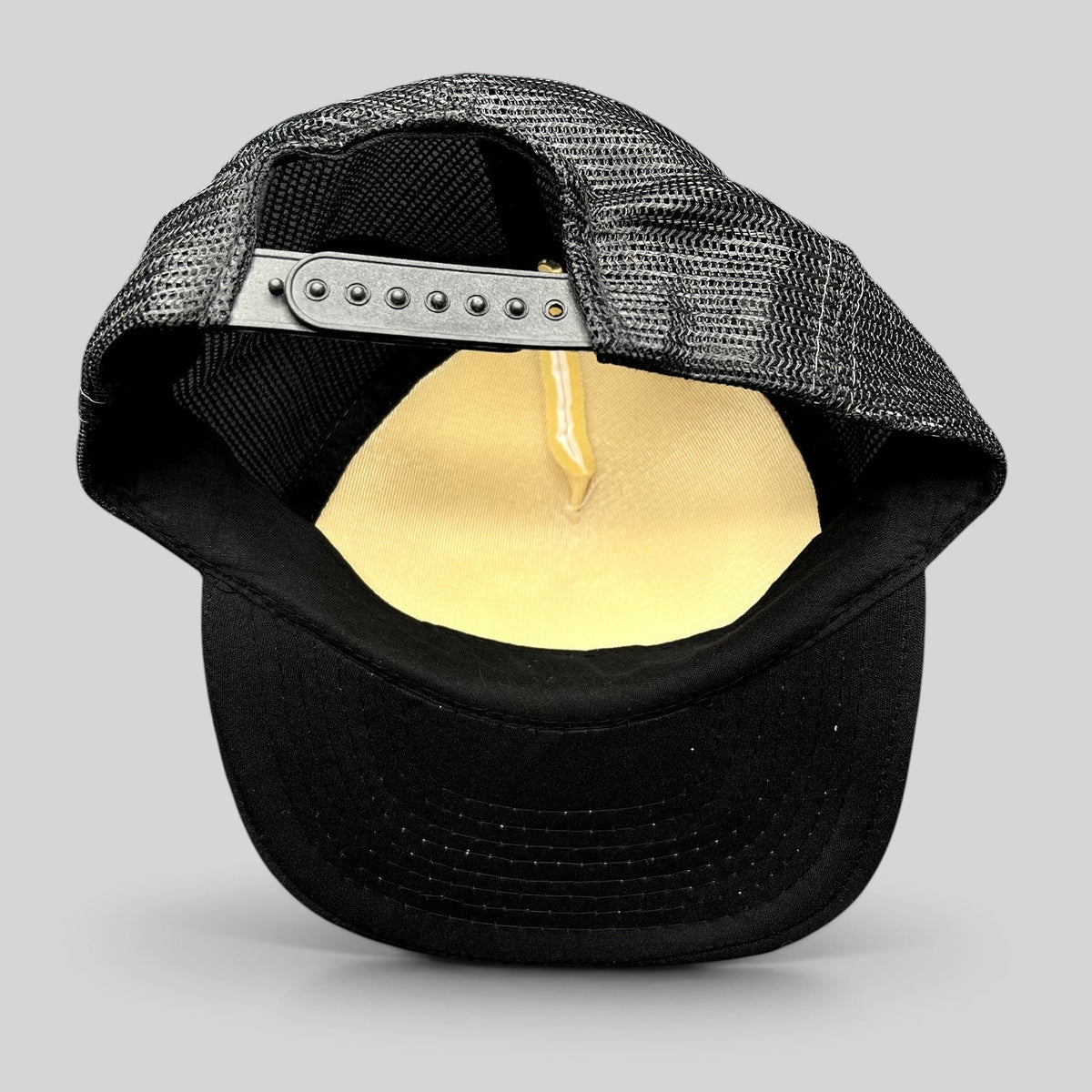 Raree Finds vintage Cassara Brothers trucker hat showing the black mesh back, adjustable snapback, and foam interior.