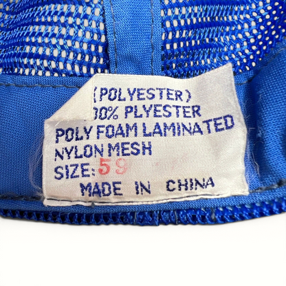 Raree Finds vintage trucker hat interior care label showing polyester and nylon mesh material composition