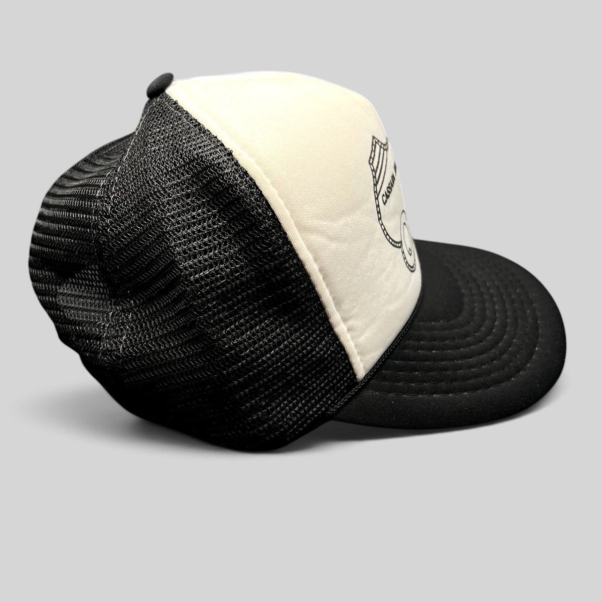 Raree Finds vintage Cassara Brothers White Star Plastering trucker hat with black mesh back and white foam front.