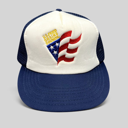 Raree Finds vintage U.S. Feed Grains Council trucker hat with white foam front, navy mesh back, and patriotic logo.