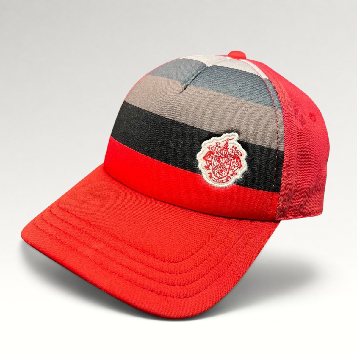 Raree Finds vintage Pukka Headwear Trump National Golf Club strapback hat in red with black and gray striped front.