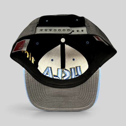 Raree Finds vintage UCLA Bruins snapback hat with black crown, powder blue brim, and interior embroidered logo detail.
