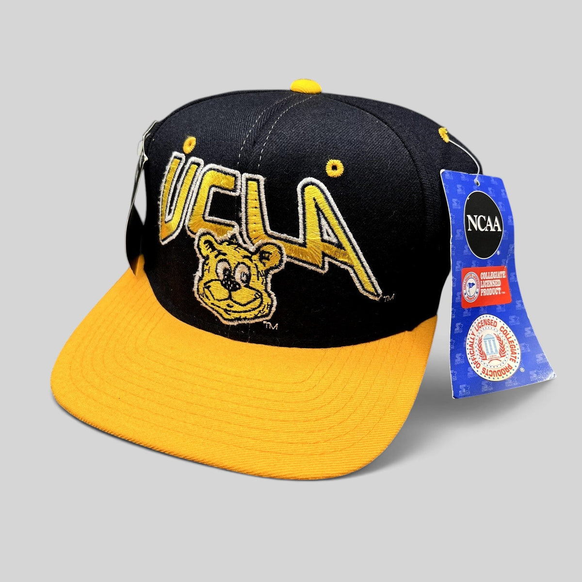 Raree Finds vintage UCLA Bruins Starter snapback hat in navy and gold wool with embroidered bear mascot and NWT.