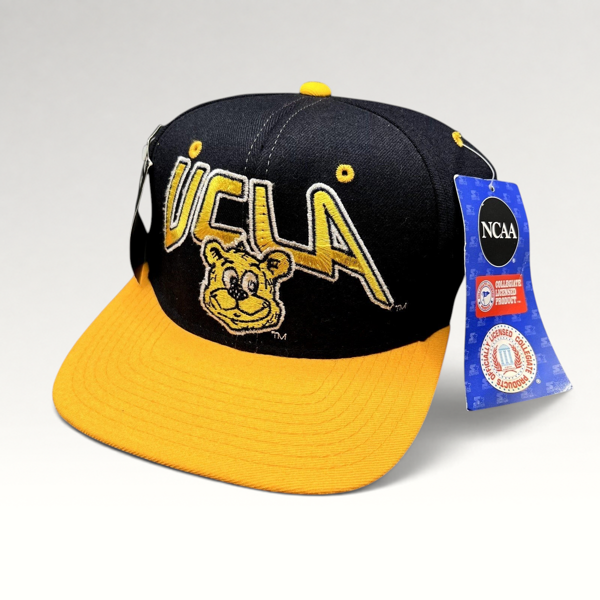 Raree Finds vintage UCLA Bruins Starter snapback hat in navy and gold wool with embroidered bear mascot and NWT.