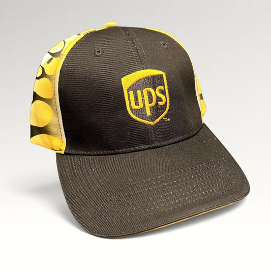 Raree Finds vintage brown and yellow UPS strapback hat with embroidered shield logo and flame side panel graphics.