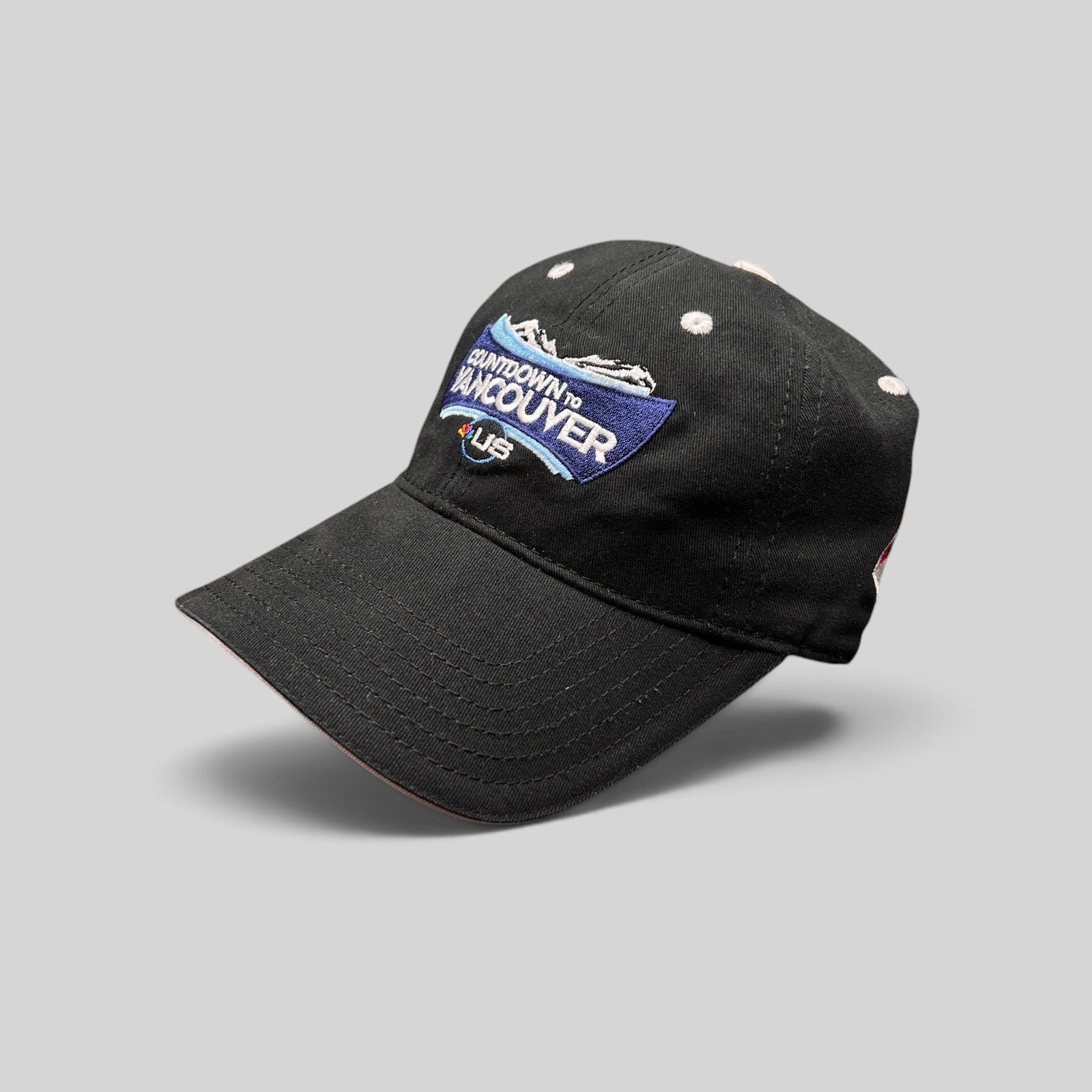Raree Finds vintage black cotton US Ski Team Countdown to Vancouver strapback hat with embroidered mountain graphic.
