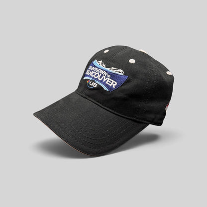 Raree Finds vintage black cotton US Ski Team Countdown to Vancouver strapback hat with embroidered mountain graphic.