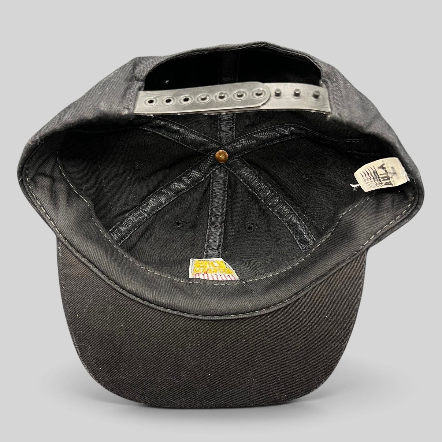 Raree Finds vintage 90s USA Ski Team snapback hat interior showing black cotton construction and original AHA tag