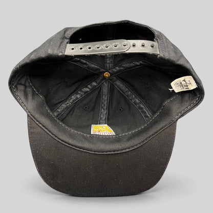 Raree Finds vintage 90s USA Ski Team snapback hat interior showing black cotton construction and original AHA tag