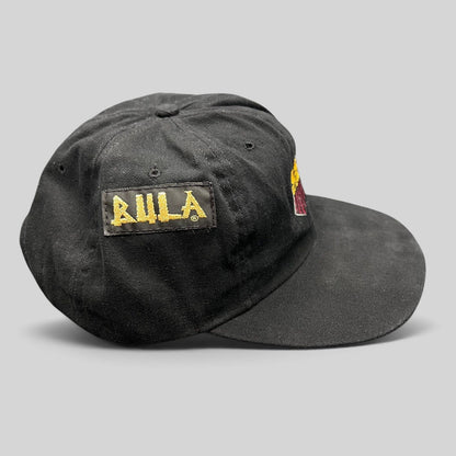 Raree Finds vintage 90s USA Ski Team black cotton snapback hat with BULA gold embroidery on the side panel