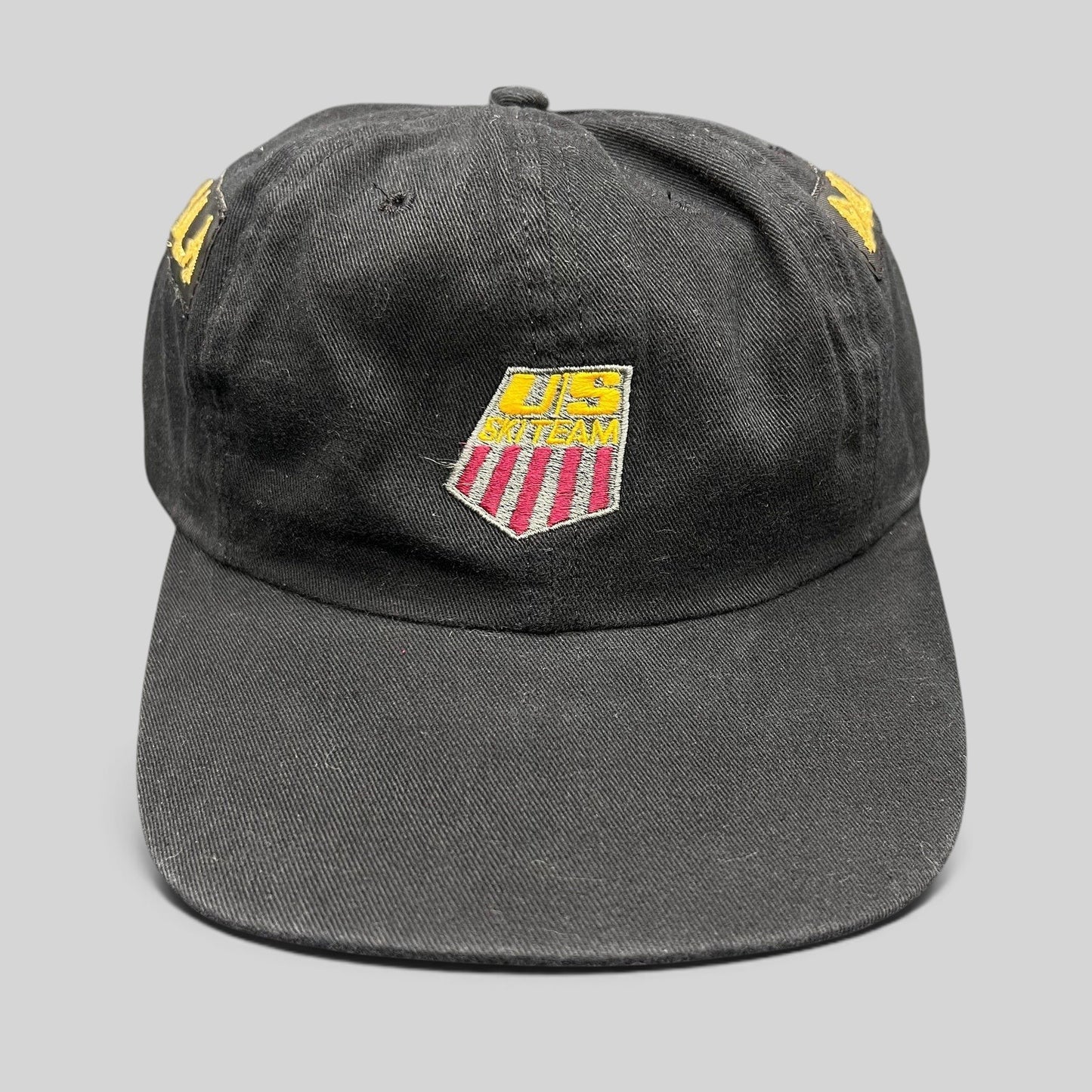 Raree Finds vintage 90s USA Ski Team black snapback hat with red, white, and gold embroidered shield logo