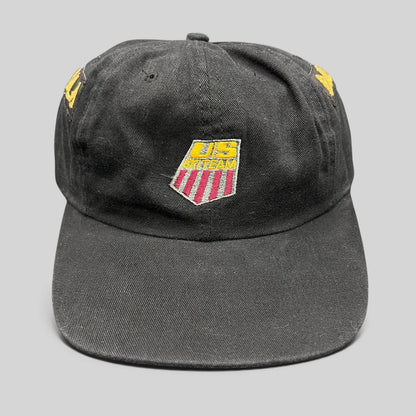 Raree Finds vintage 90s USA Ski Team black snapback hat with red, white, and gold embroidered shield logo