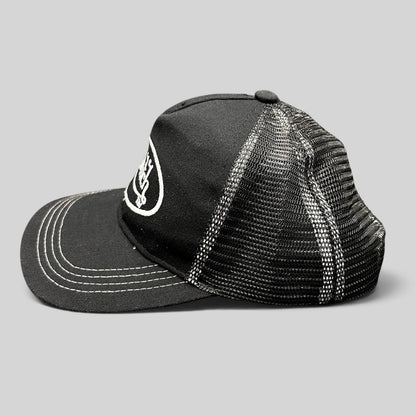 Raree Finds vintage Von Dutch black and white trucker hat with embroidered logo, mesh back, and contrast stitching.