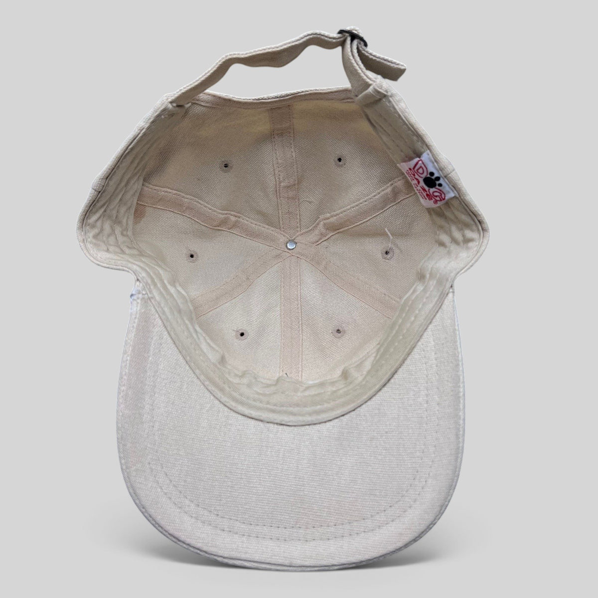 Interior view of a Raree Finds vintage Wailers cotton canvas strapback hat showing the six-panel construction.