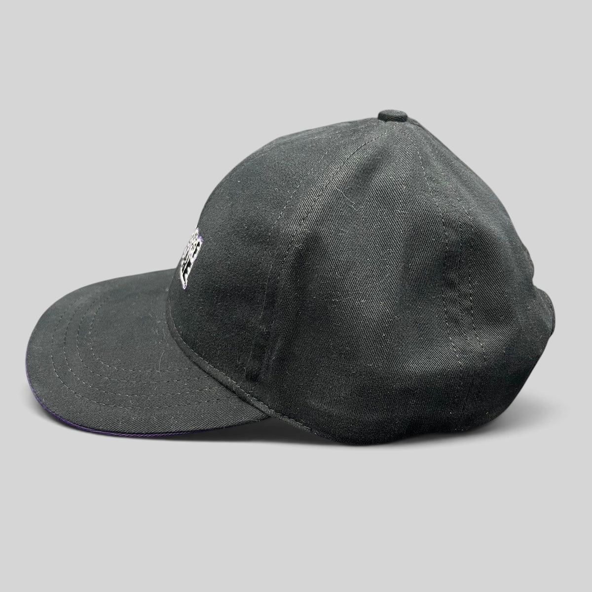 Raree Finds vintage Wheel of Fortune snapback hat in black with a purple brim accent and embroidered show logo.