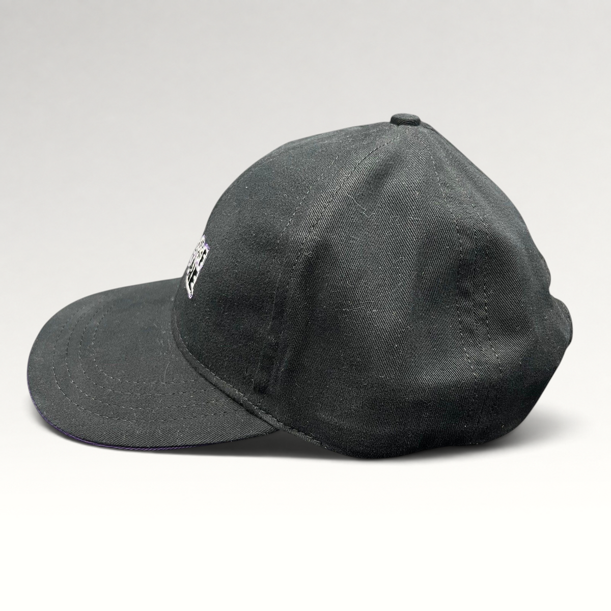 Raree Finds vintage Wheel of Fortune snapback hat in black with a purple brim accent and embroidered show logo.