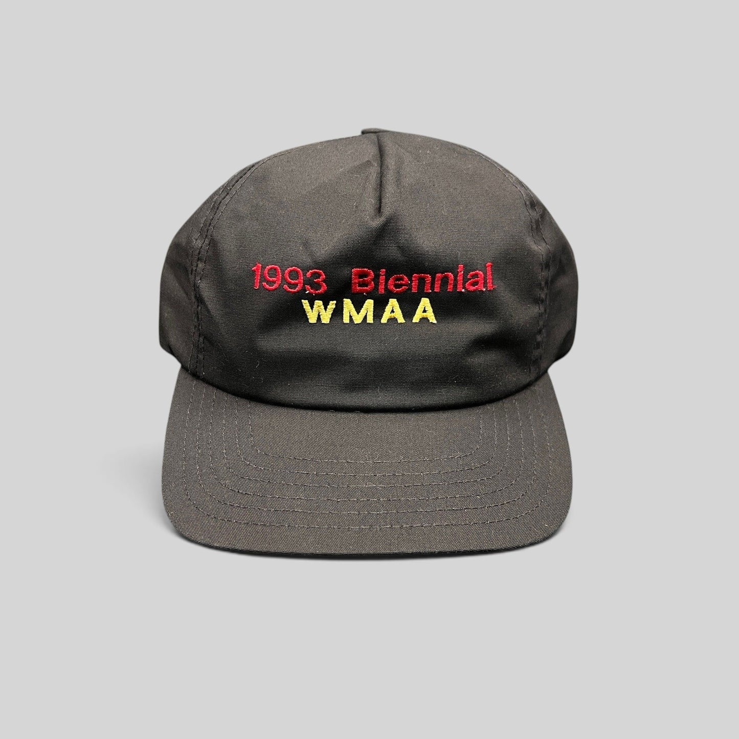 Raree Finds vintage 1993 WMAA Biennial black snapback cap with red and yellow embroidery and a flat bill