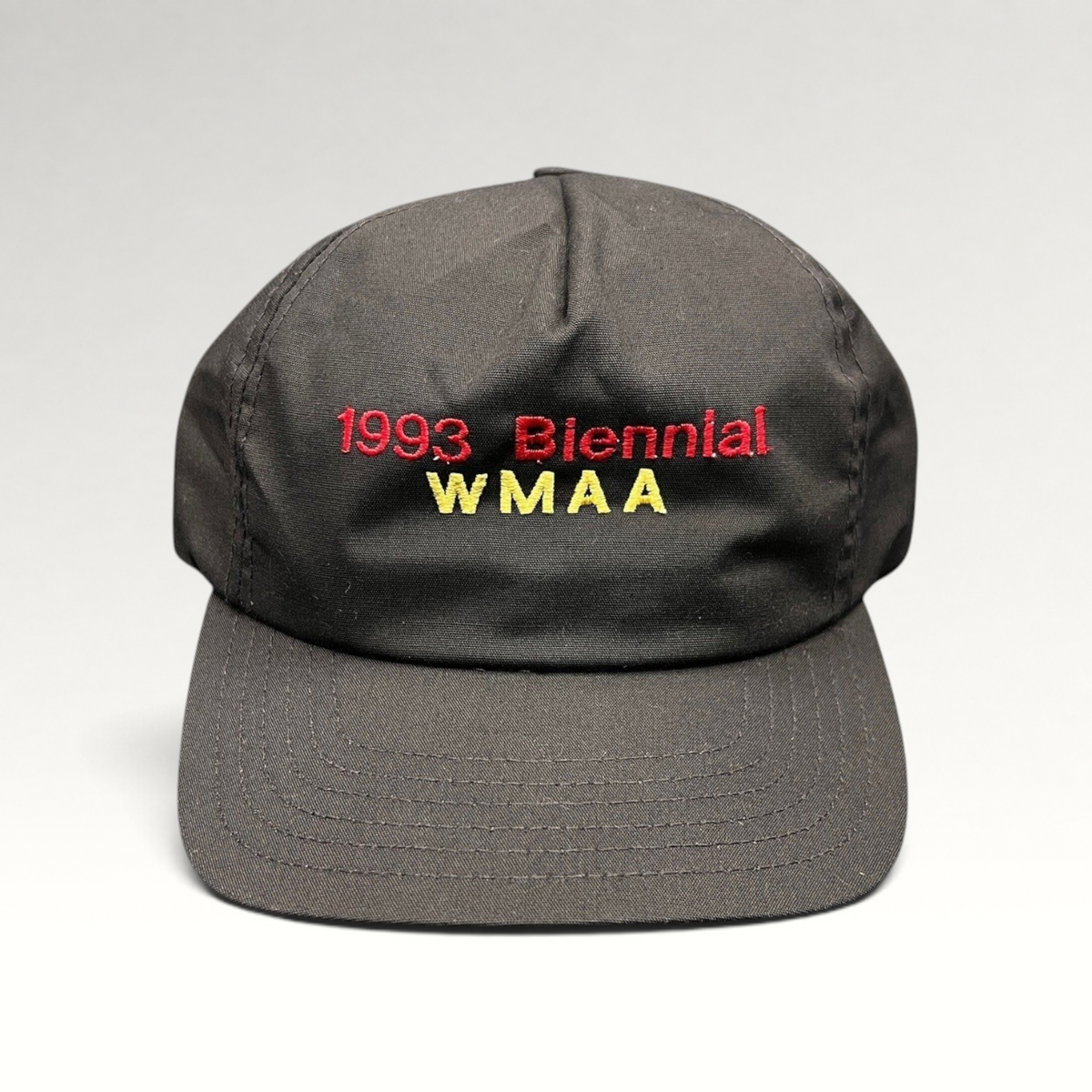 Raree Finds vintage 1993 WMAA Biennial black snapback cap with red and yellow embroidery and a flat bill