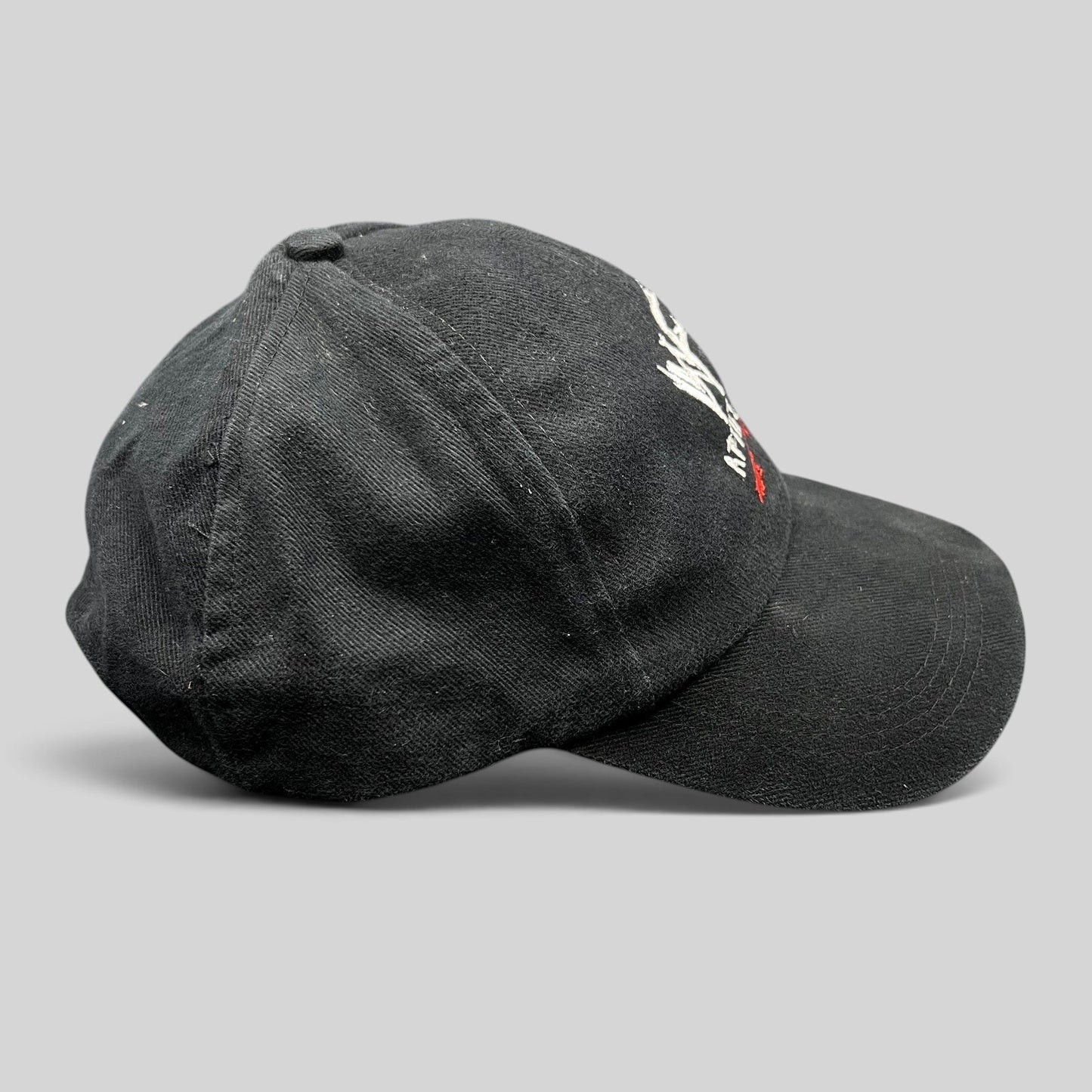 Raree Finds vintage black WWF Attitude Era snapback hat with embroidered scratch logo and adjustable back closure.