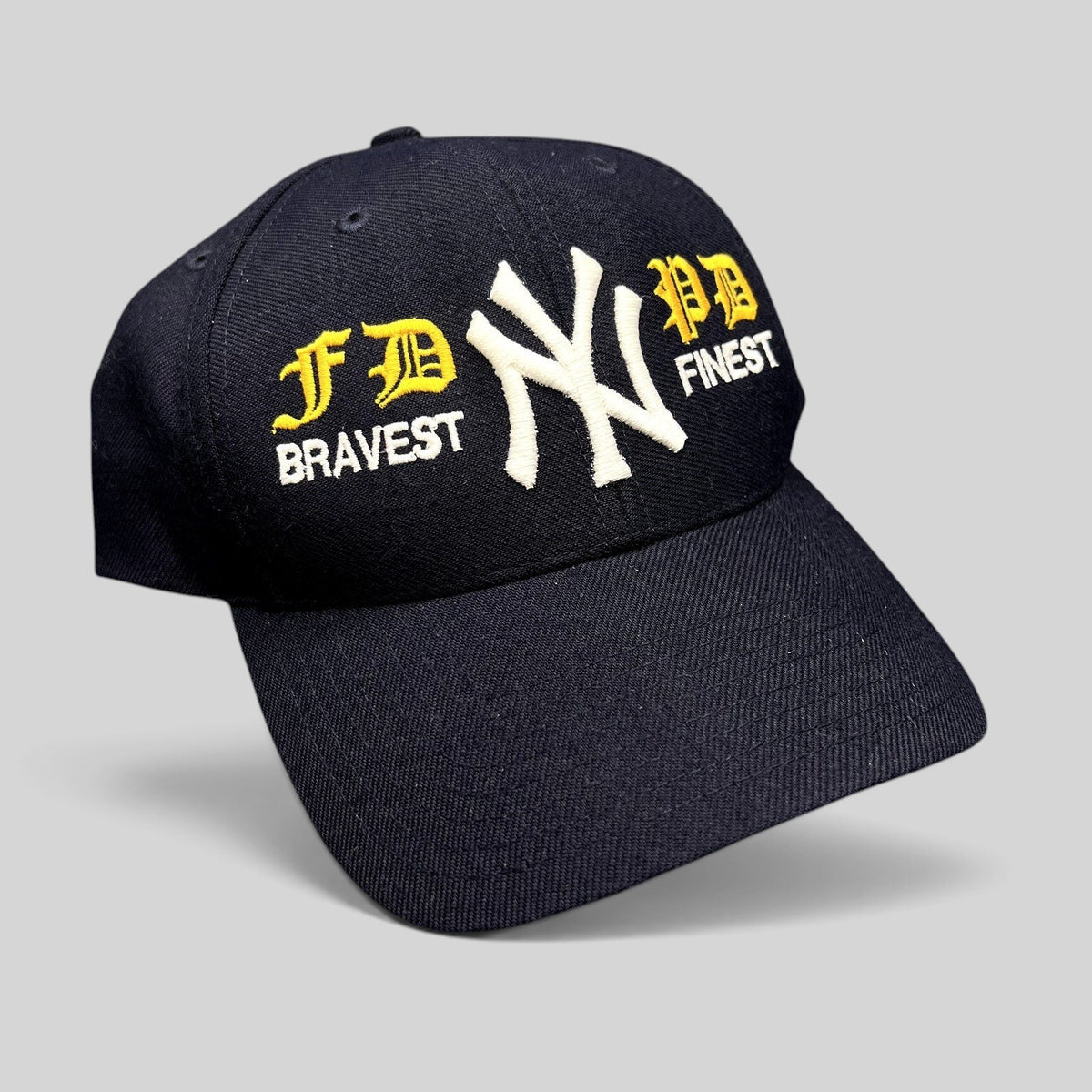 Raree Finds vintage navy New York Yankees snapback hat with embroidered FDNY and NYPD tribute lettering