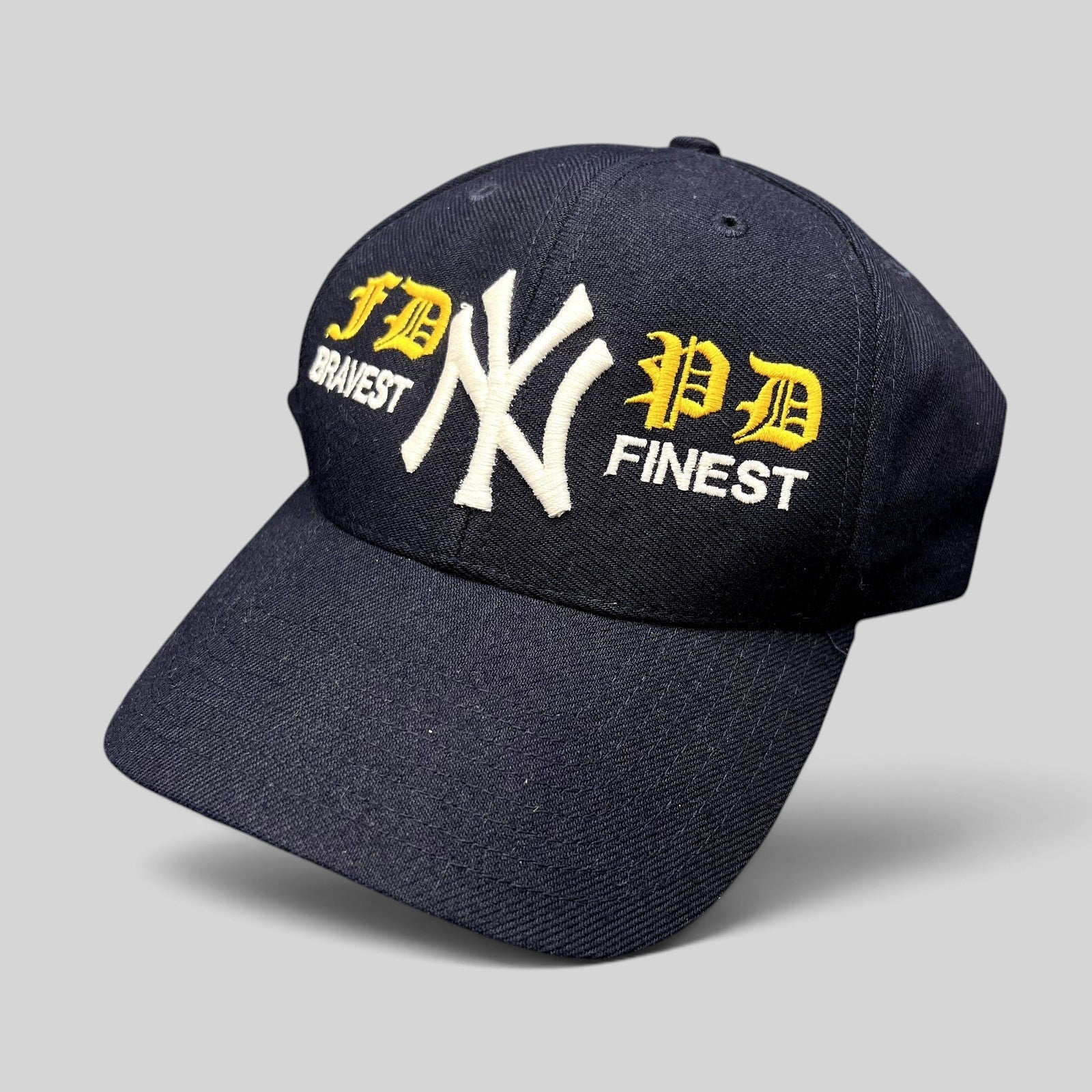 Raree Finds vintage navy New York Yankees snapback hat with FDNY and NYPD tribute embroidery in white and yellow