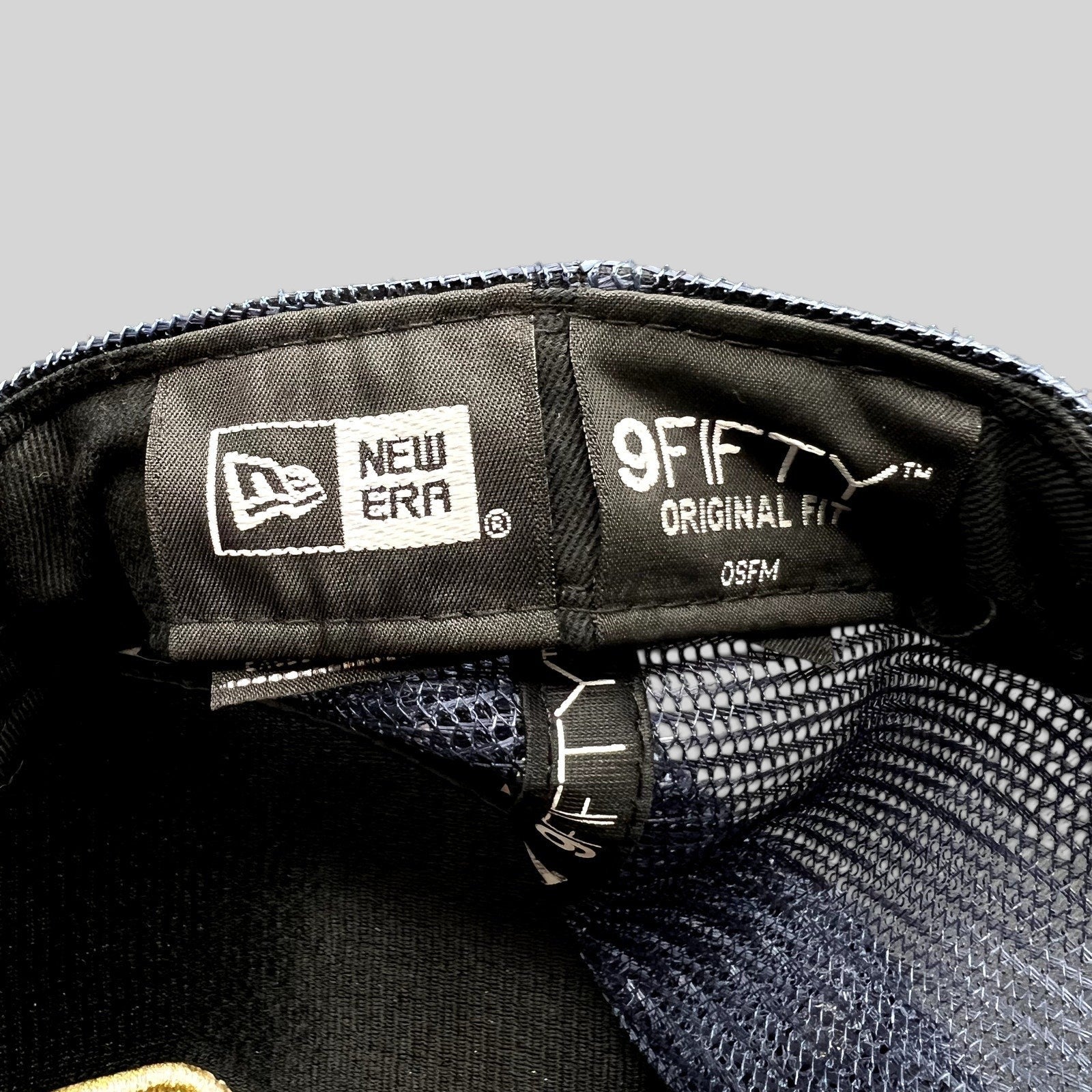 Raree Finds Volcom x New Era 9FIFTY trucker hat interior label showing branding and mesh construction