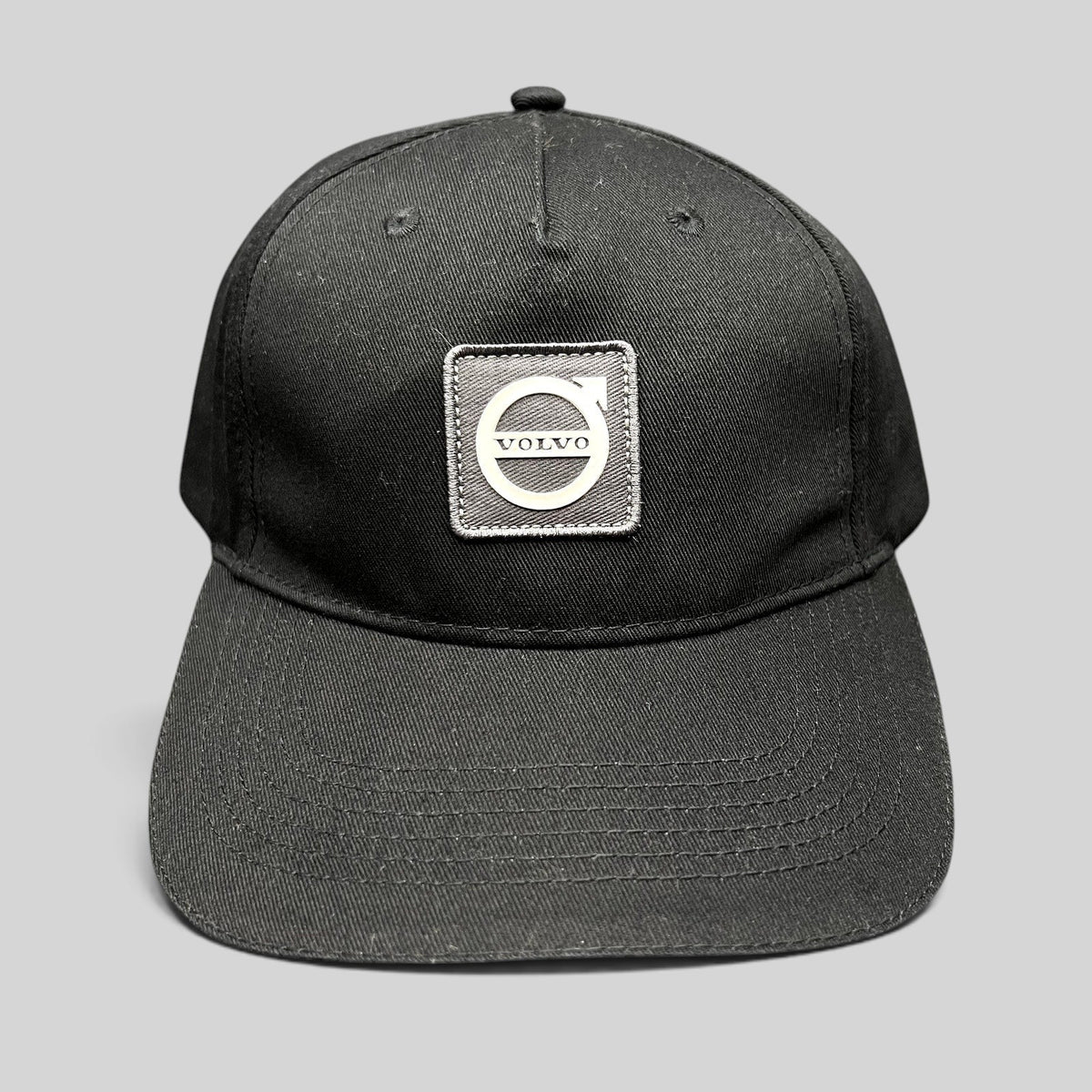 Raree Finds black organic cotton adjustable hat featuring a raised rubberized Volvo Iron Mark logo patch.