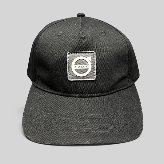 Raree Finds black organic cotton adjustable hat featuring a raised rubberized Volvo Iron Mark logo patch.