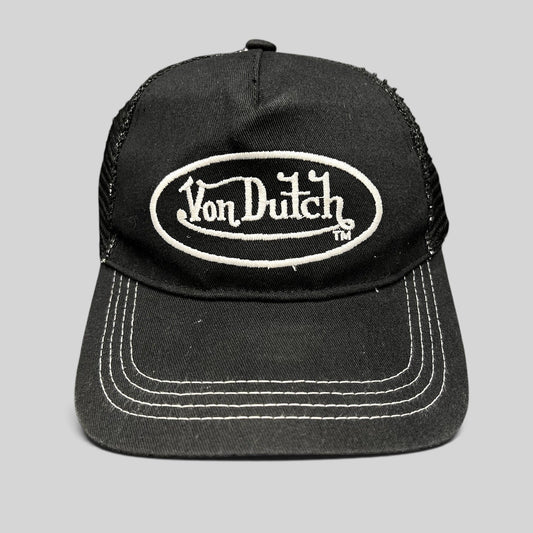 Raree Finds vintage Von Dutch black and white trucker hat with embroidered oval logo and contrast stitching.