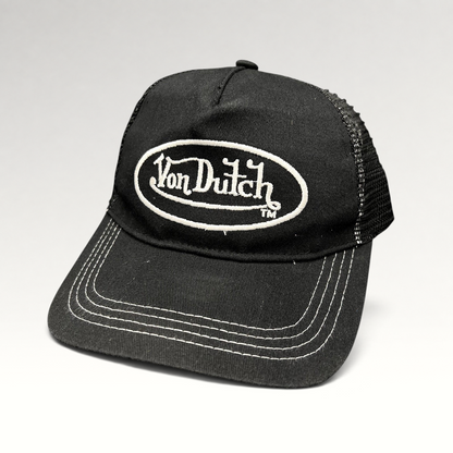 Raree Finds vintage Von Dutch black trucker hat with white oval logo embroidery, mesh back, and contrast stitching.