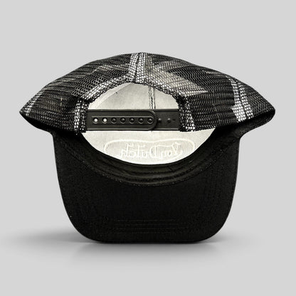 Raree Finds vintage Von Dutch black and white trucker hat showing the adjustable snapback closure and mesh back panel