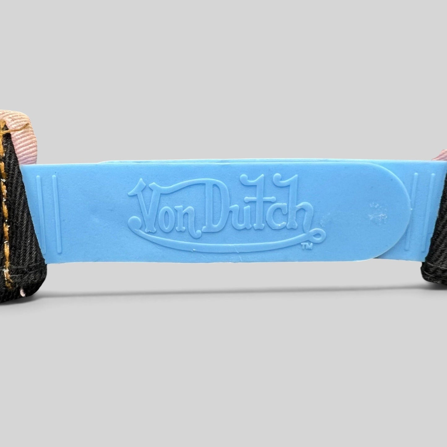 Raree Finds vintage Von Dutch blue plastic strapback closure with embossed logo detail from a Y2K terry cloth visor