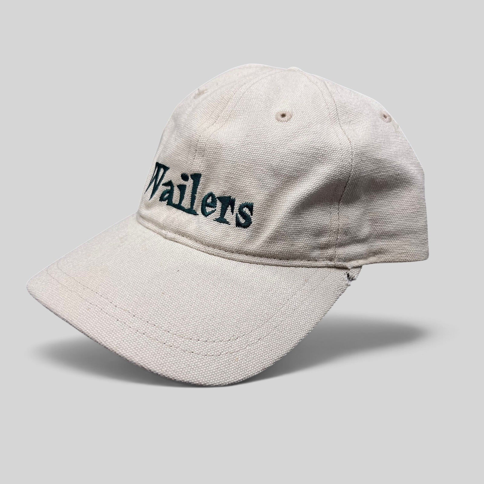 Raree Finds vintage 90s Wailers reggae strapback hat in off-white cotton canvas with dark green embroidered logo.