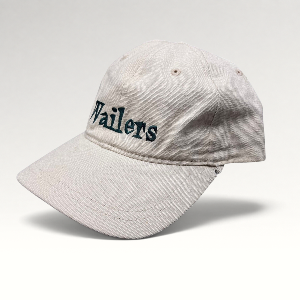Raree Finds vintage 90s Wailers reggae strapback hat in off-white cotton canvas with dark green embroidered logo.