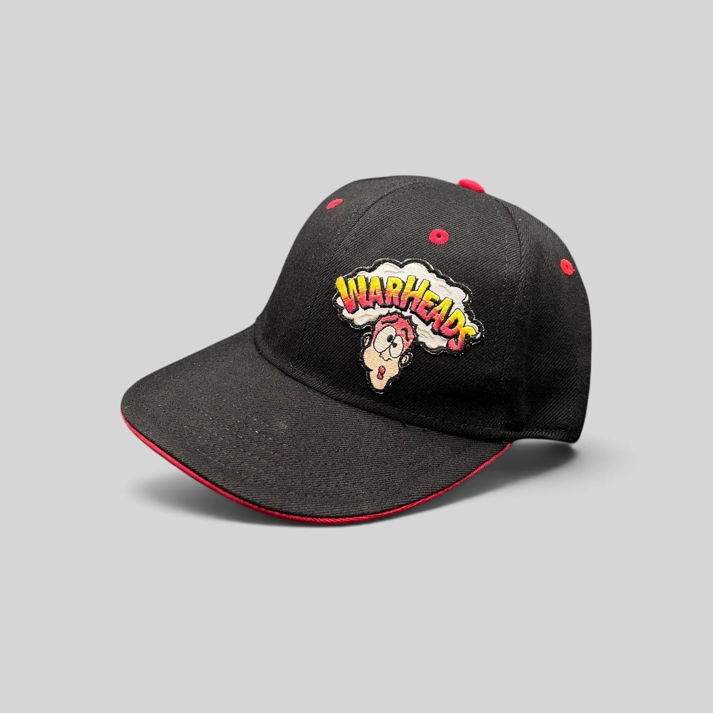 Raree Finds vintage Y2K Warheads candy promo hat in black with a red brim and embroidered exploding head logo.
