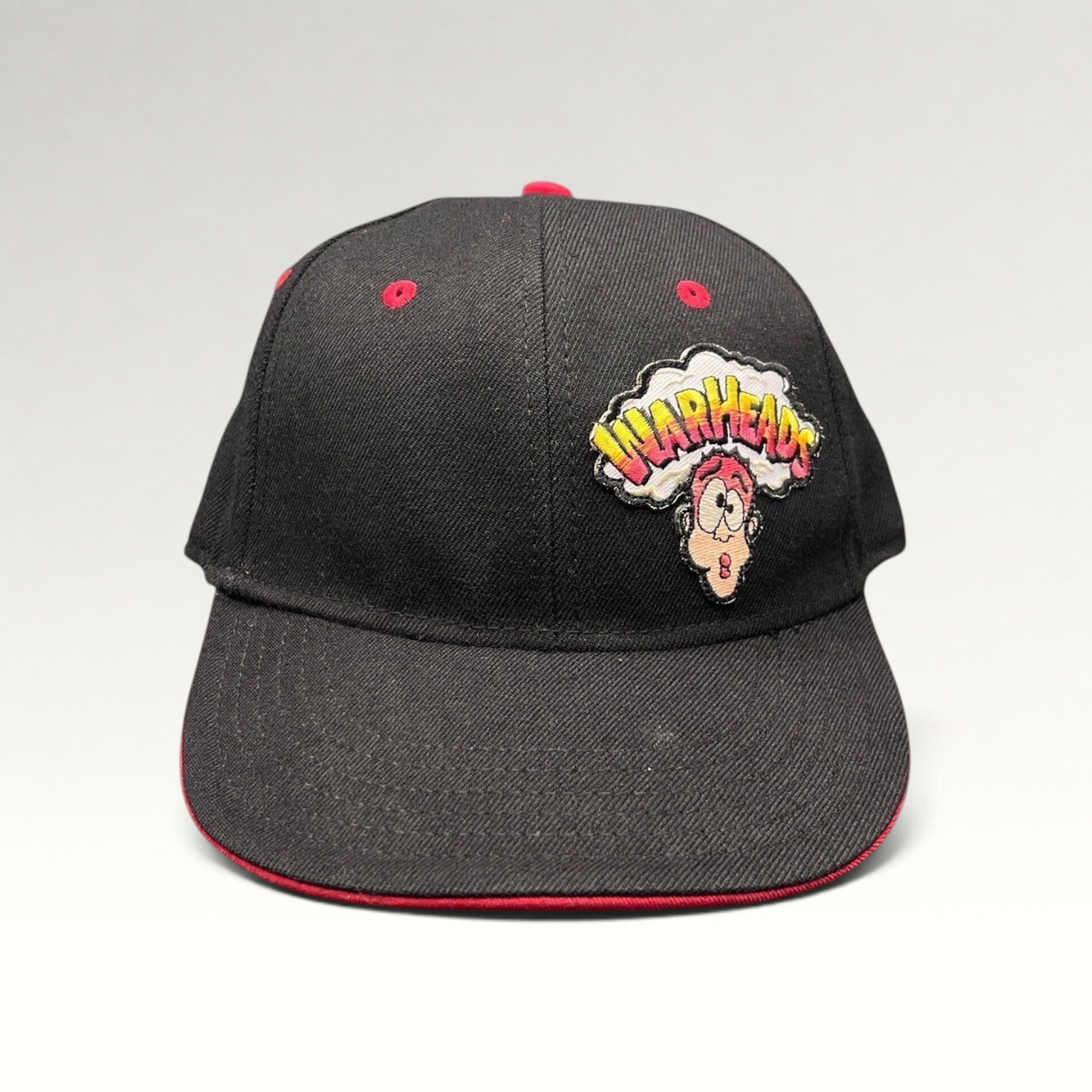 Raree Finds vintage Y2K Warheads candy promo hat with black crown, red brim, and embroidered logo on Otto Flex base