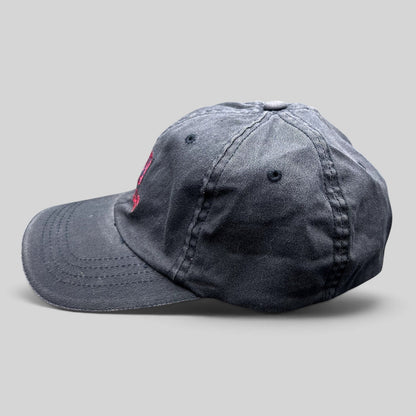 Raree Finds vintage Warren Miller Entertainment black Flexfit hat with red embroidered logo and contrast brim piping