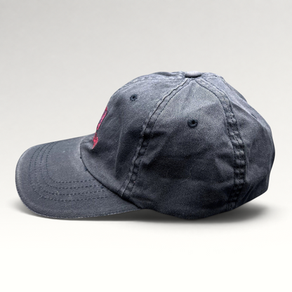 Raree Finds vintage Warren Miller Entertainment black Flexfit hat with red embroidered logo and contrast brim piping